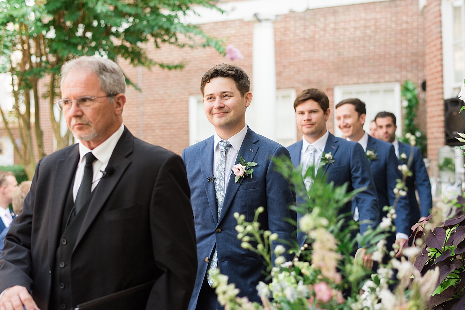 groom and groomsmen enter ceremony