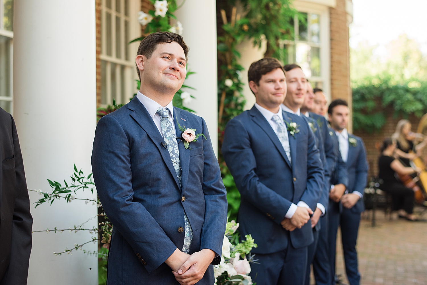 groom awaits his bride at altar