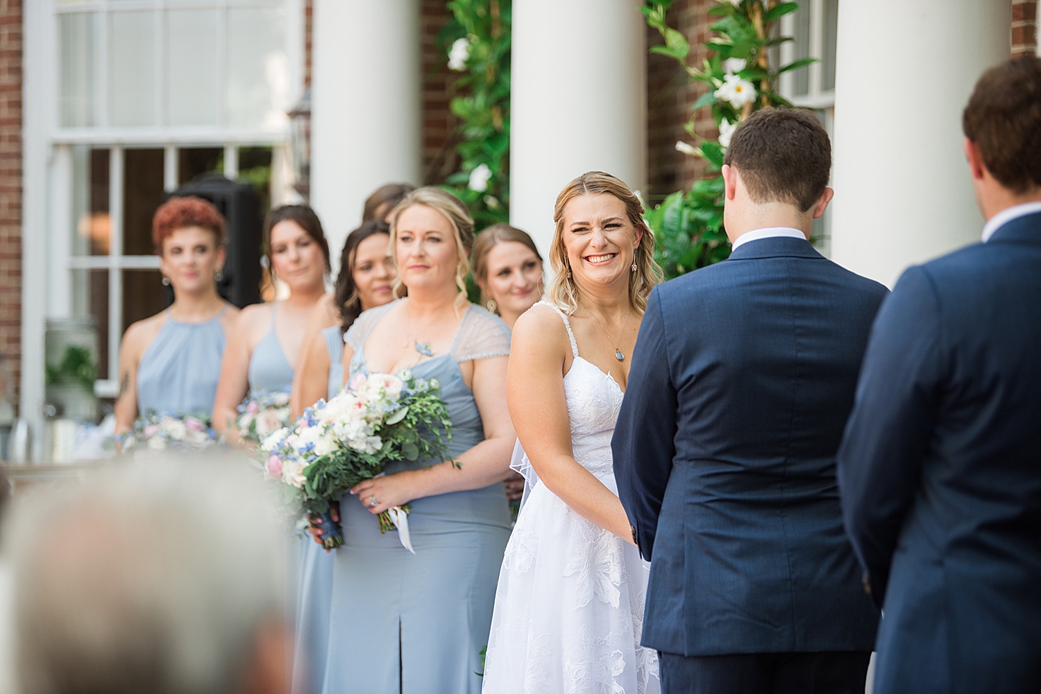 bride smiles during wedding ceremony