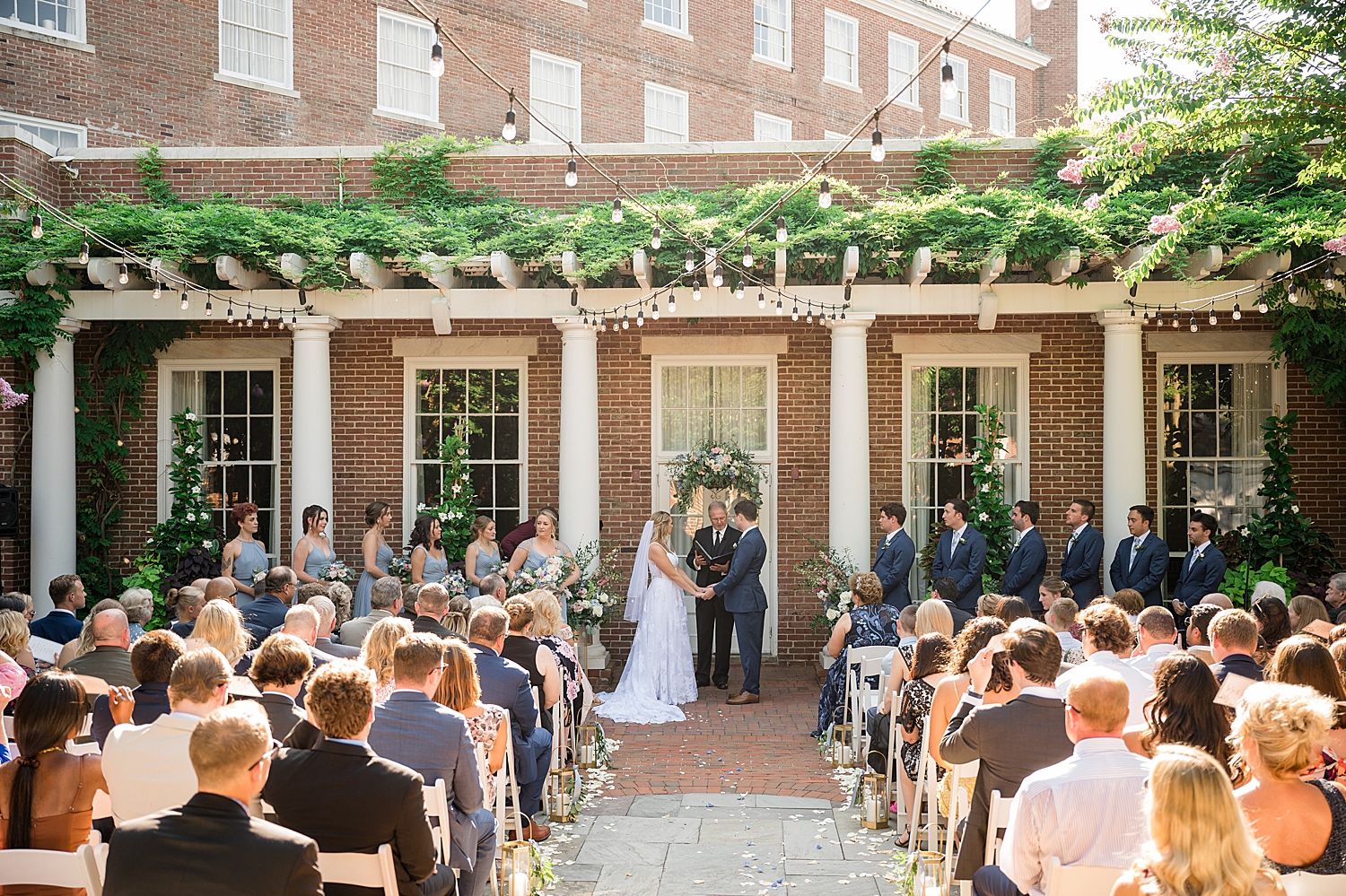 wide shot tidewater inn outdoor wedding ceremony