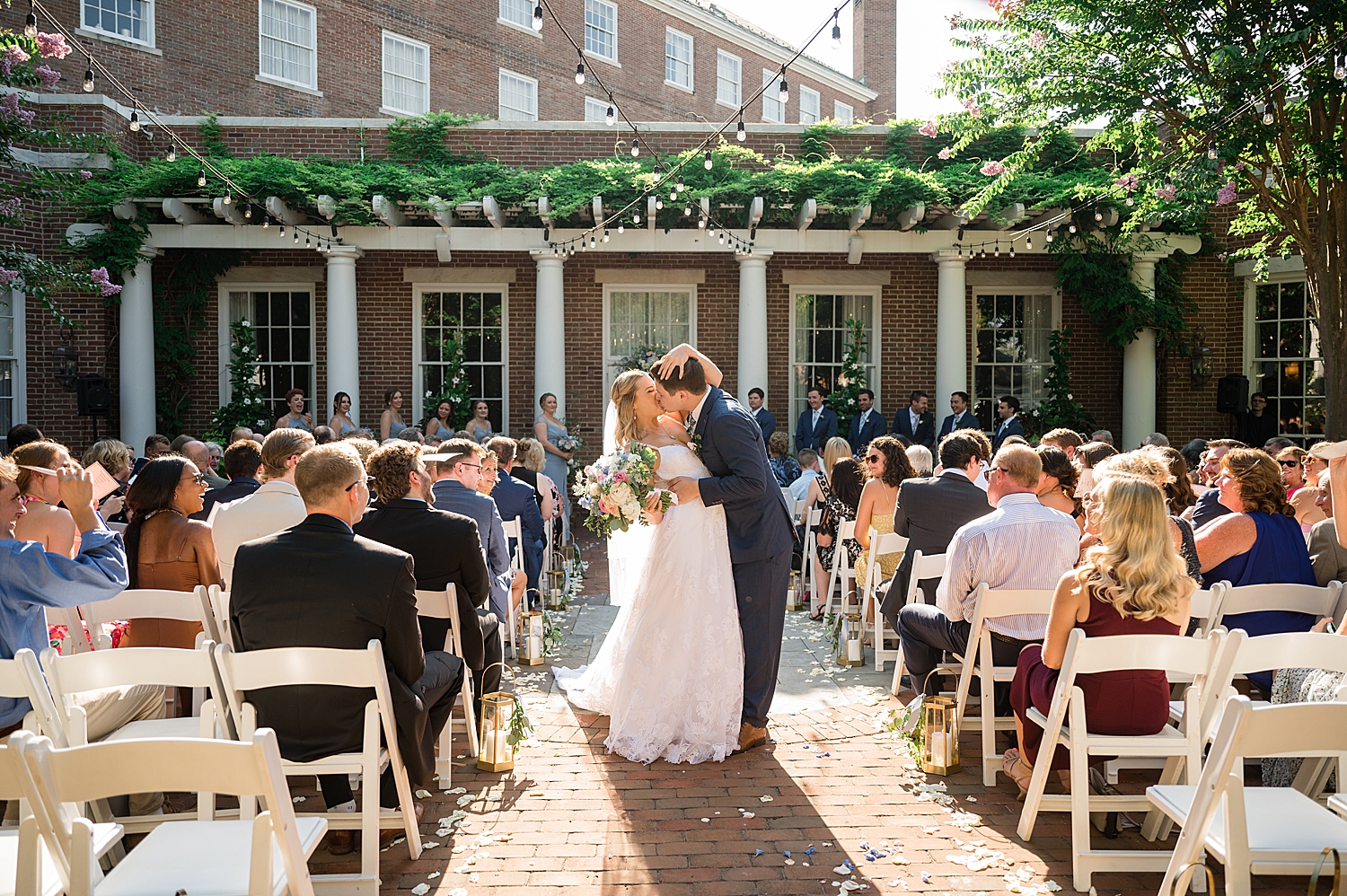 bride and groom recess from ceremony kiss