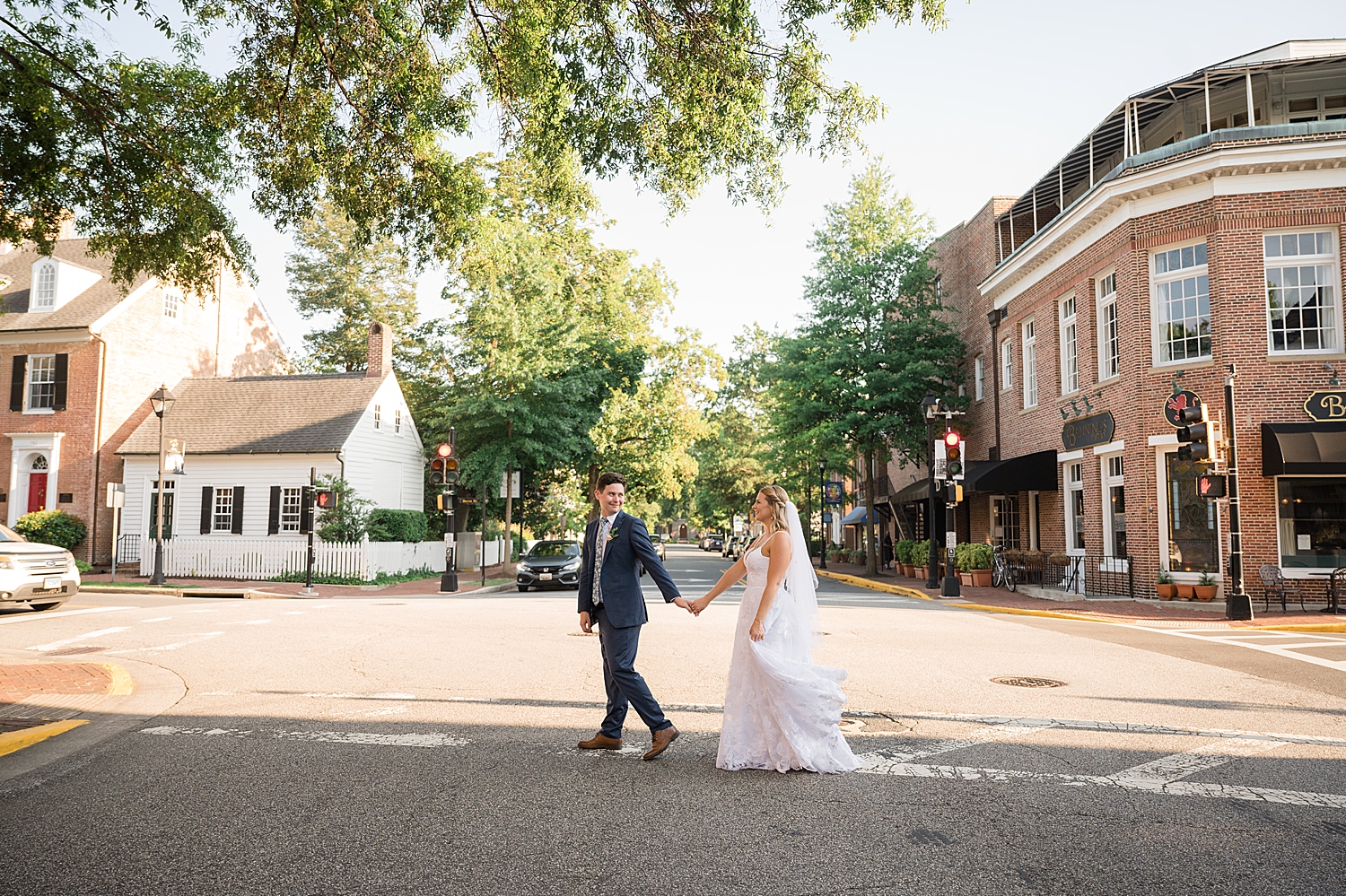 bride and groom cross the street