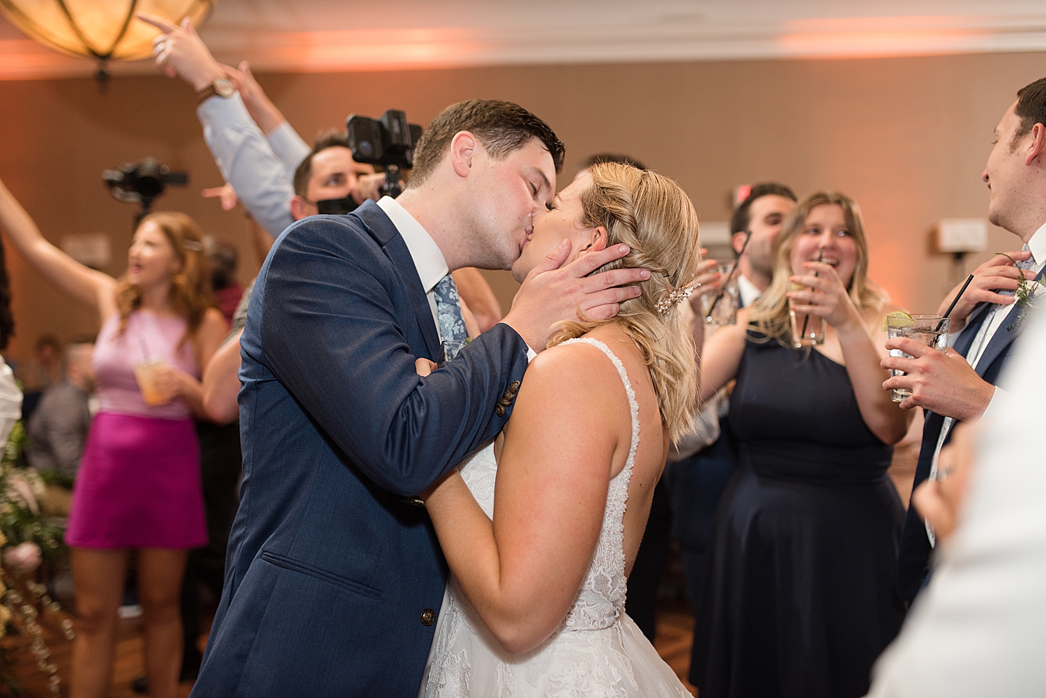 candid wedding dancing, bride and groom kiss