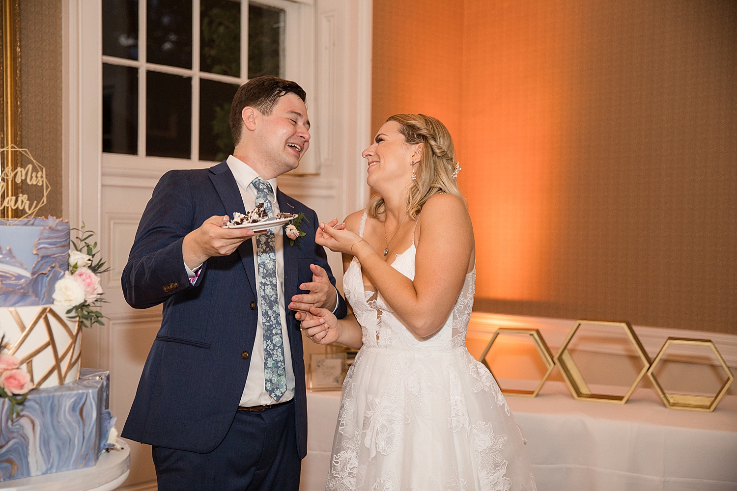 bride and groom cut the cake