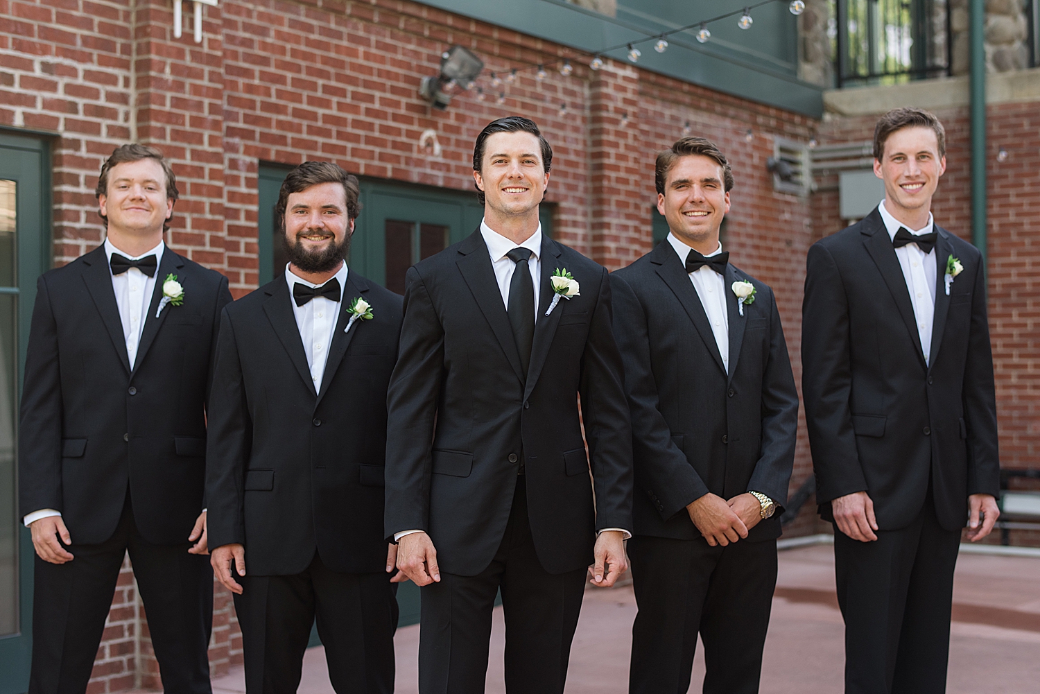 groom and groomsmen in classic tuxes