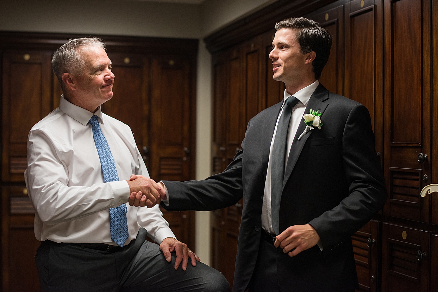 groom shaking dad's hand