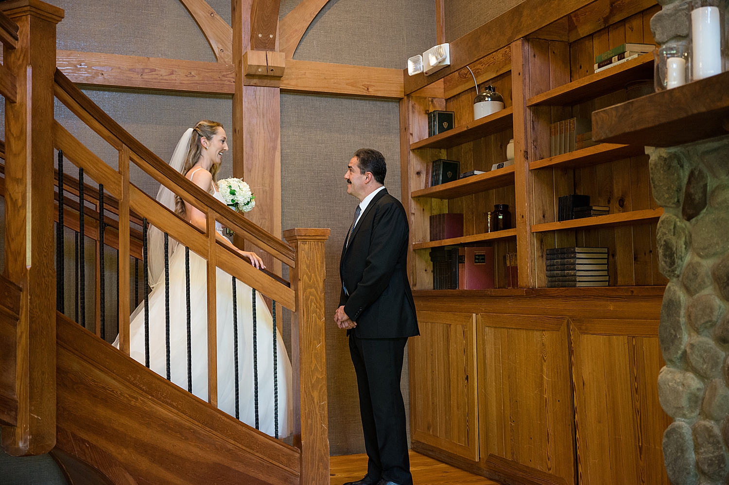 bride seeing dad for the first time on golf club stairs