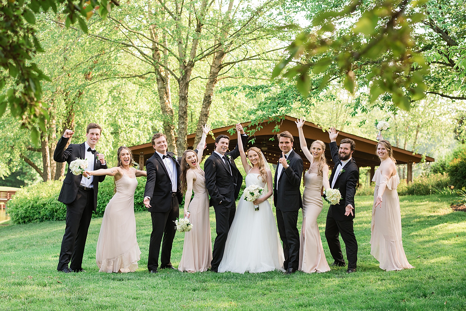 full wedding party cheering