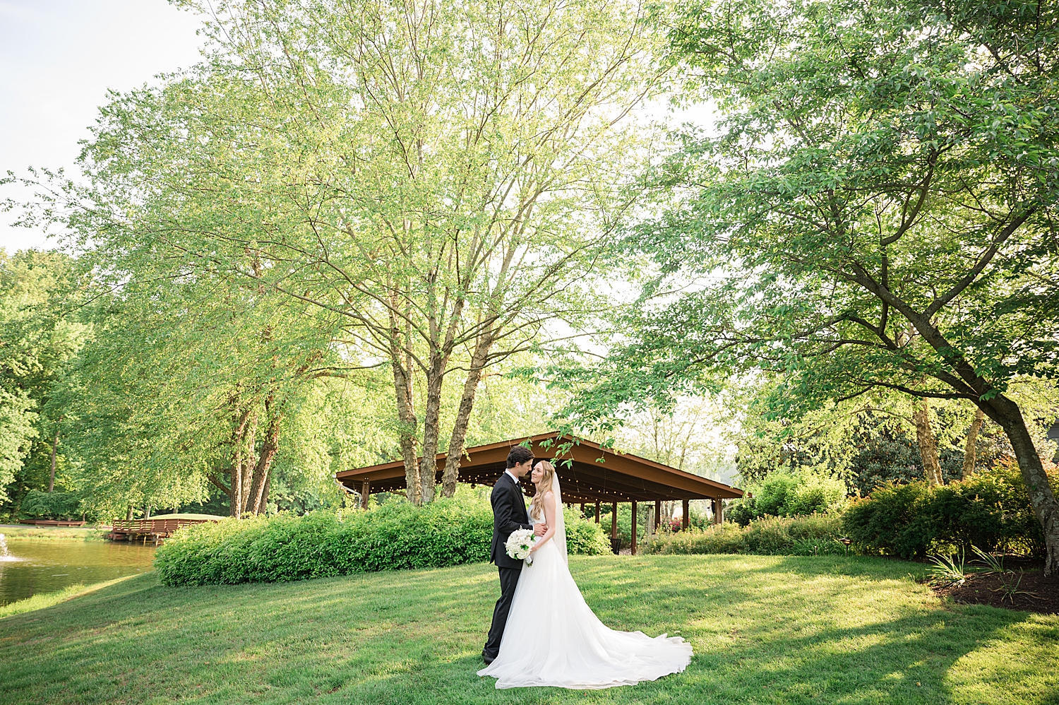 bride and groom wide shot kiss