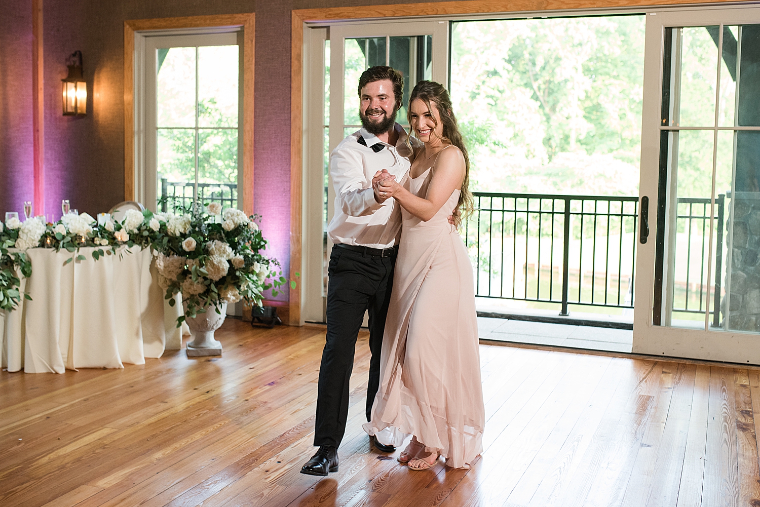 bridesmaid and groomsman enter reception