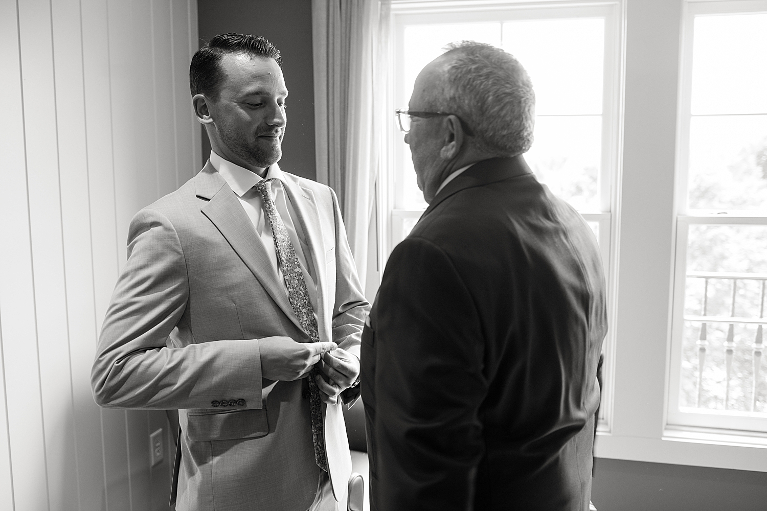 groom getting ready with dad