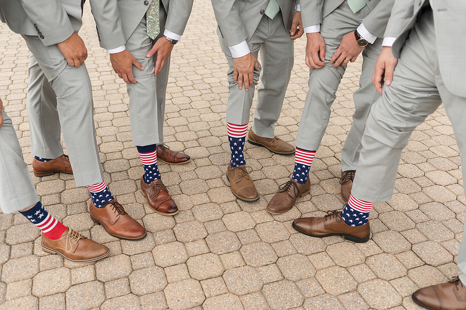 groomsmen show off american flag socks