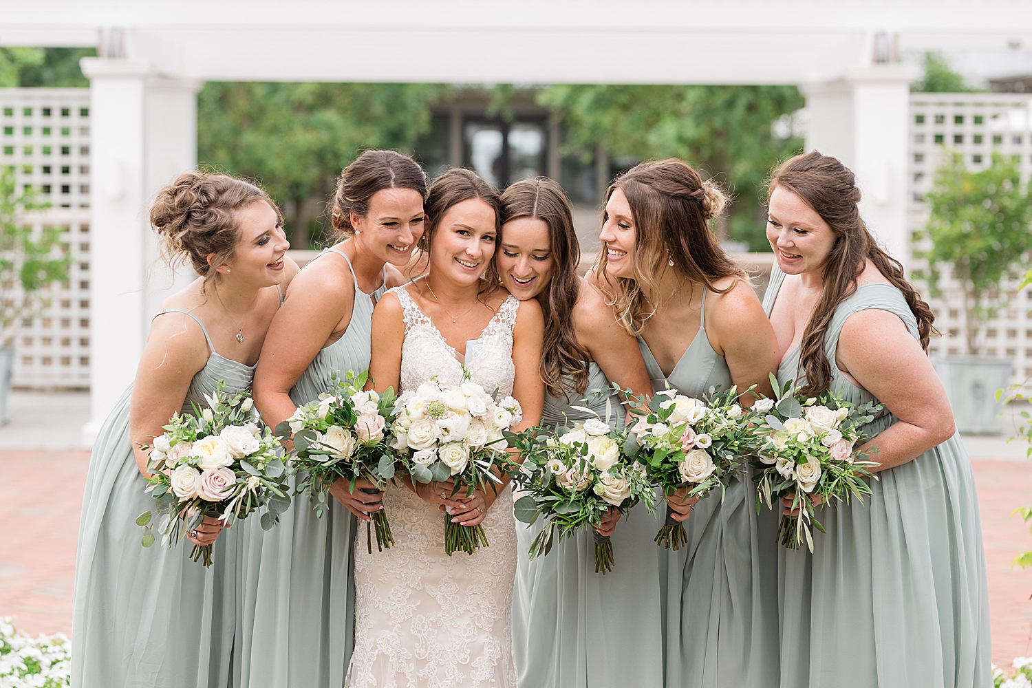 bride and bridesmaids laughing