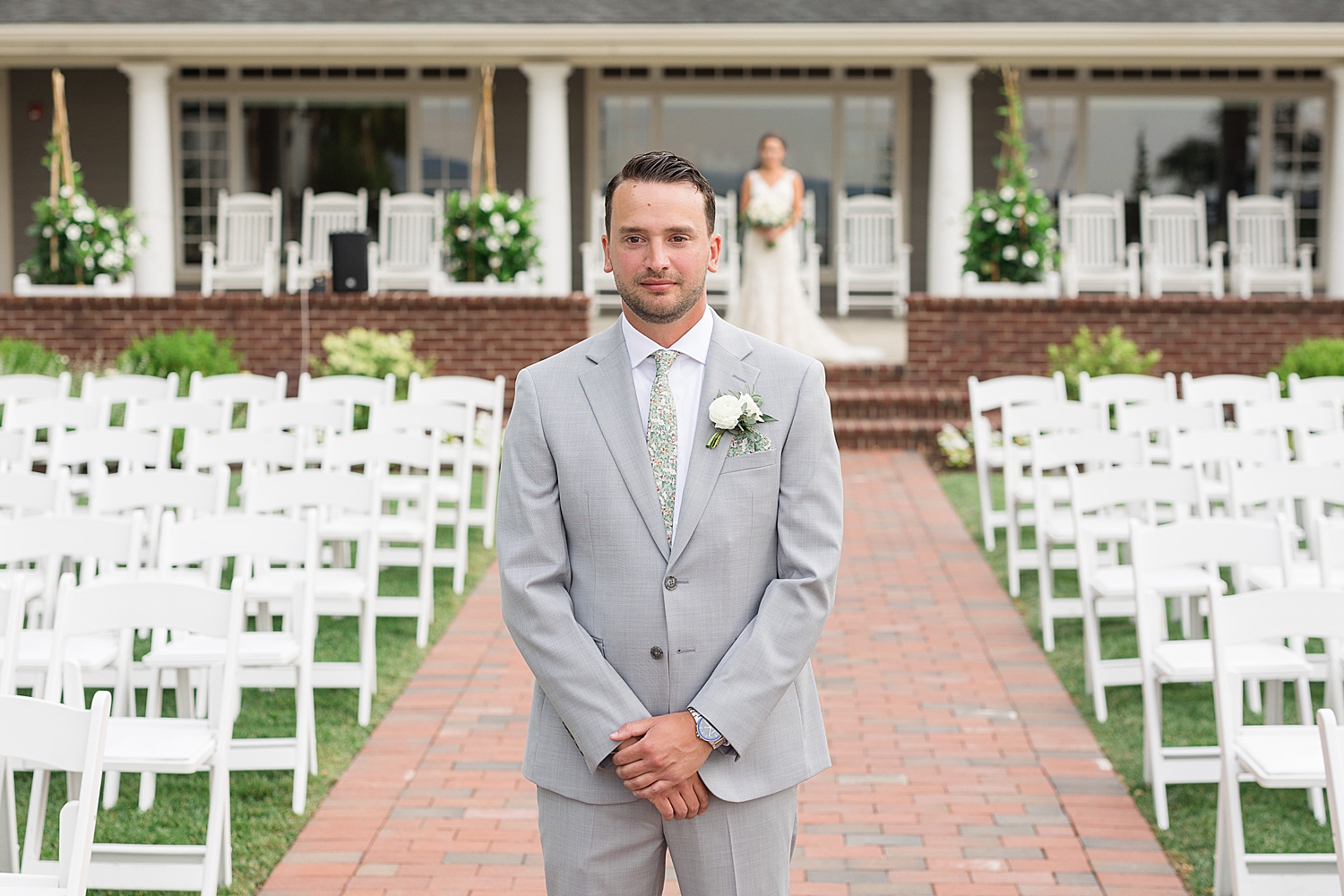 groom waiting for first look with bride