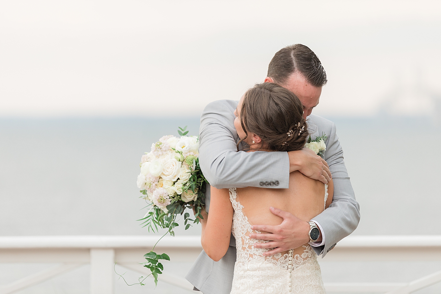 bride and groom embrace