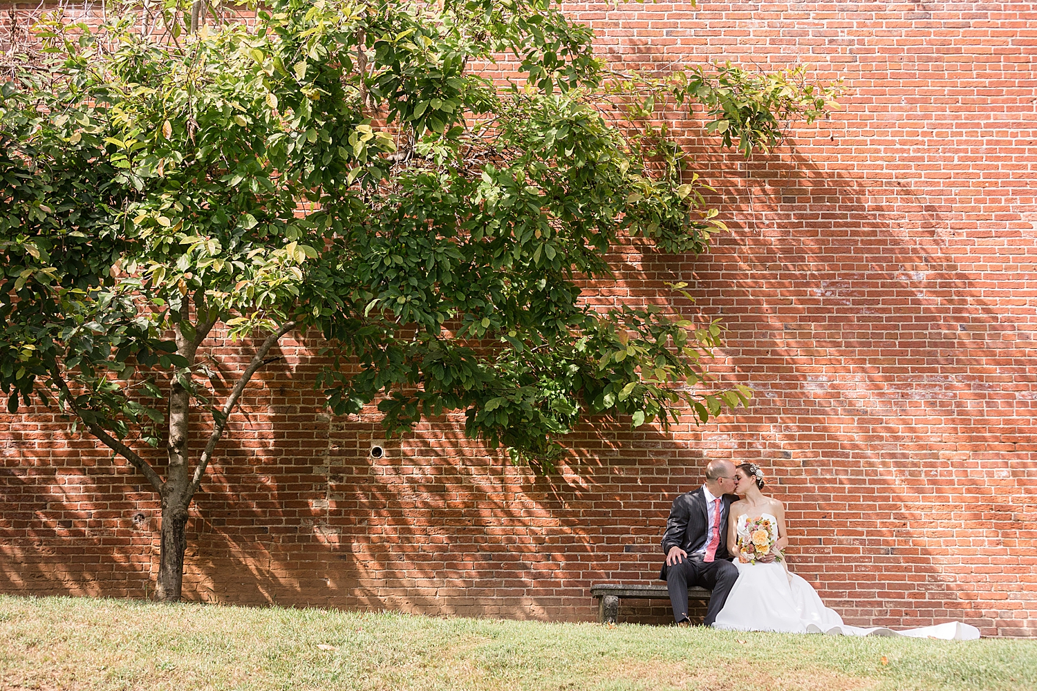 bride and groom portrait brick wall