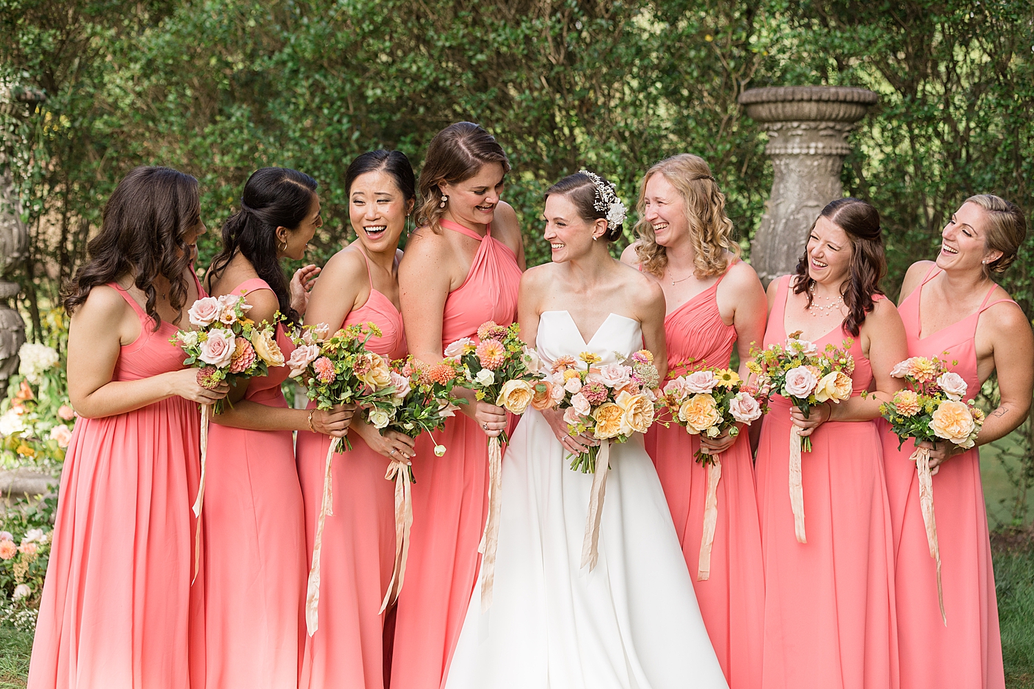 bride with bridesmaids in coral