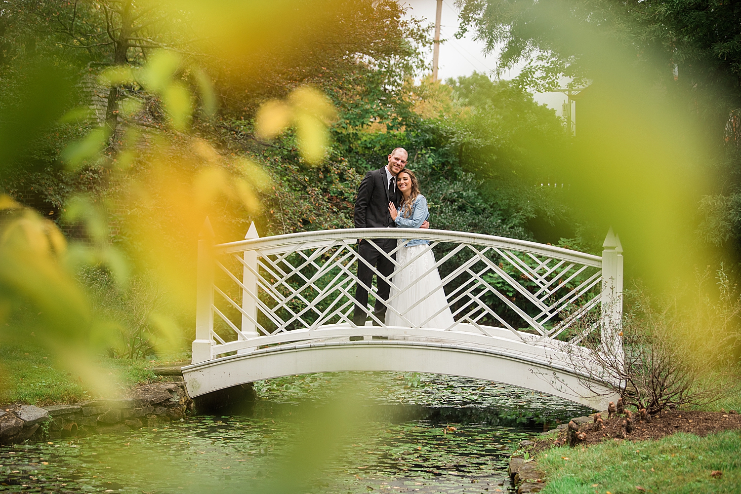 bride and groom portrait on bridge at paca house