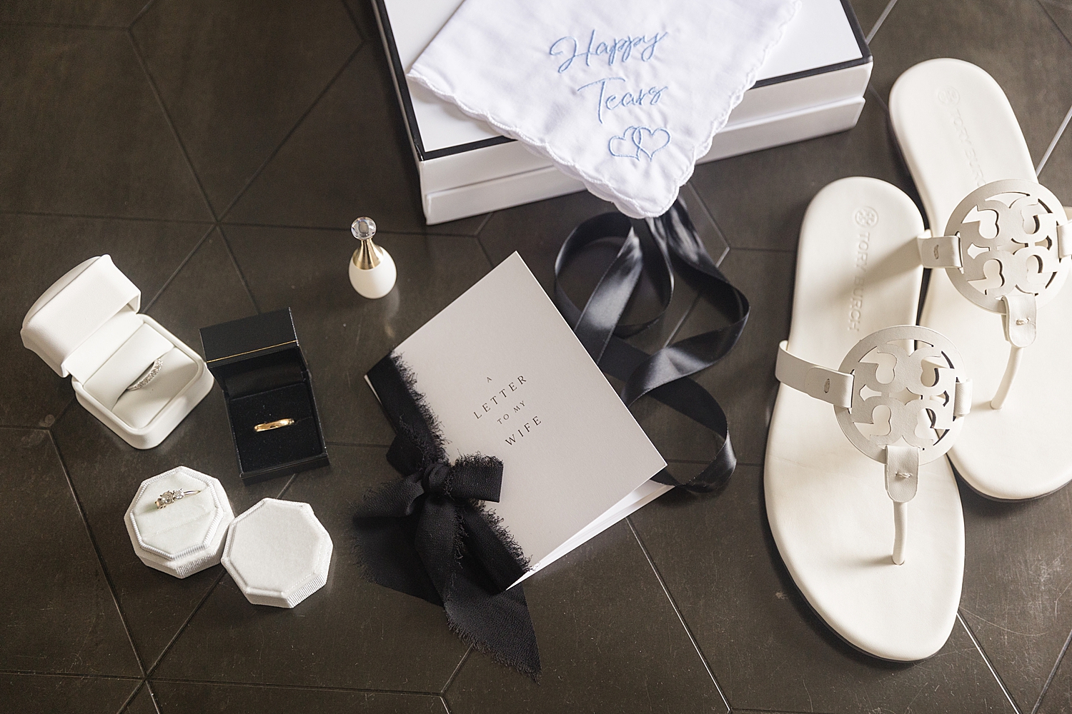 black and white wedding details flat lay