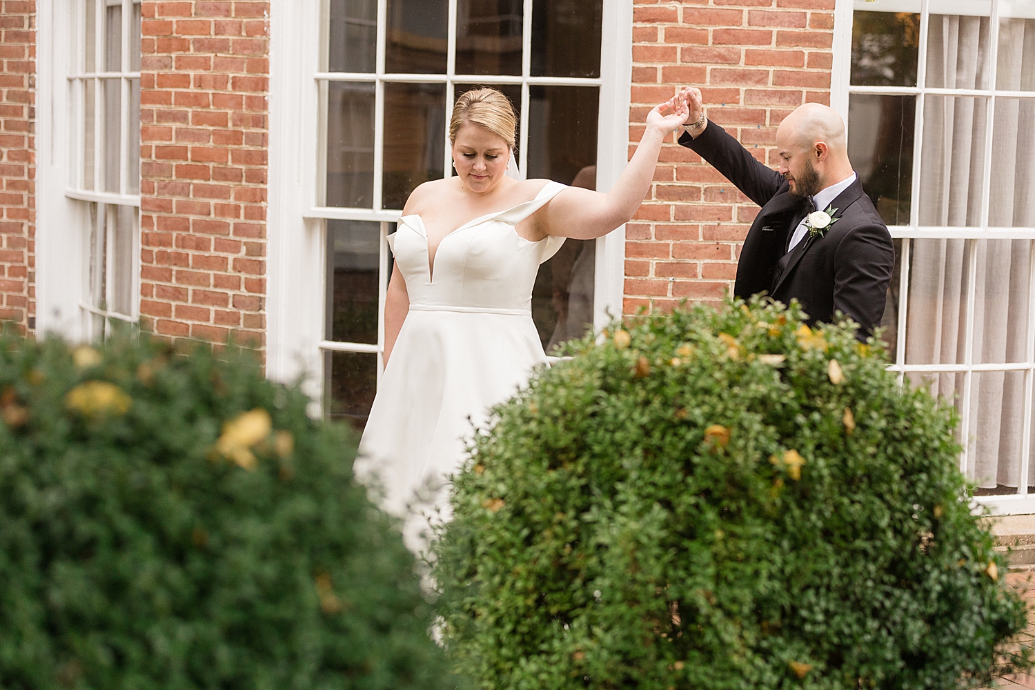 groom twirls the bride