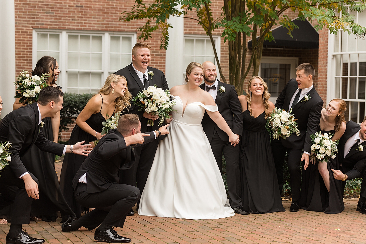 wedding party being silly with bride and groom