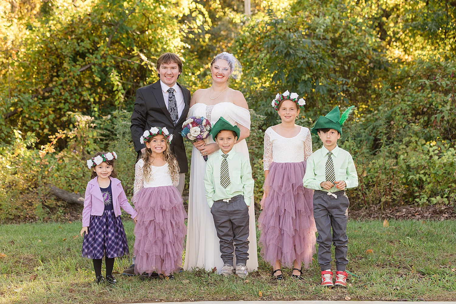 couple with wedding party kids