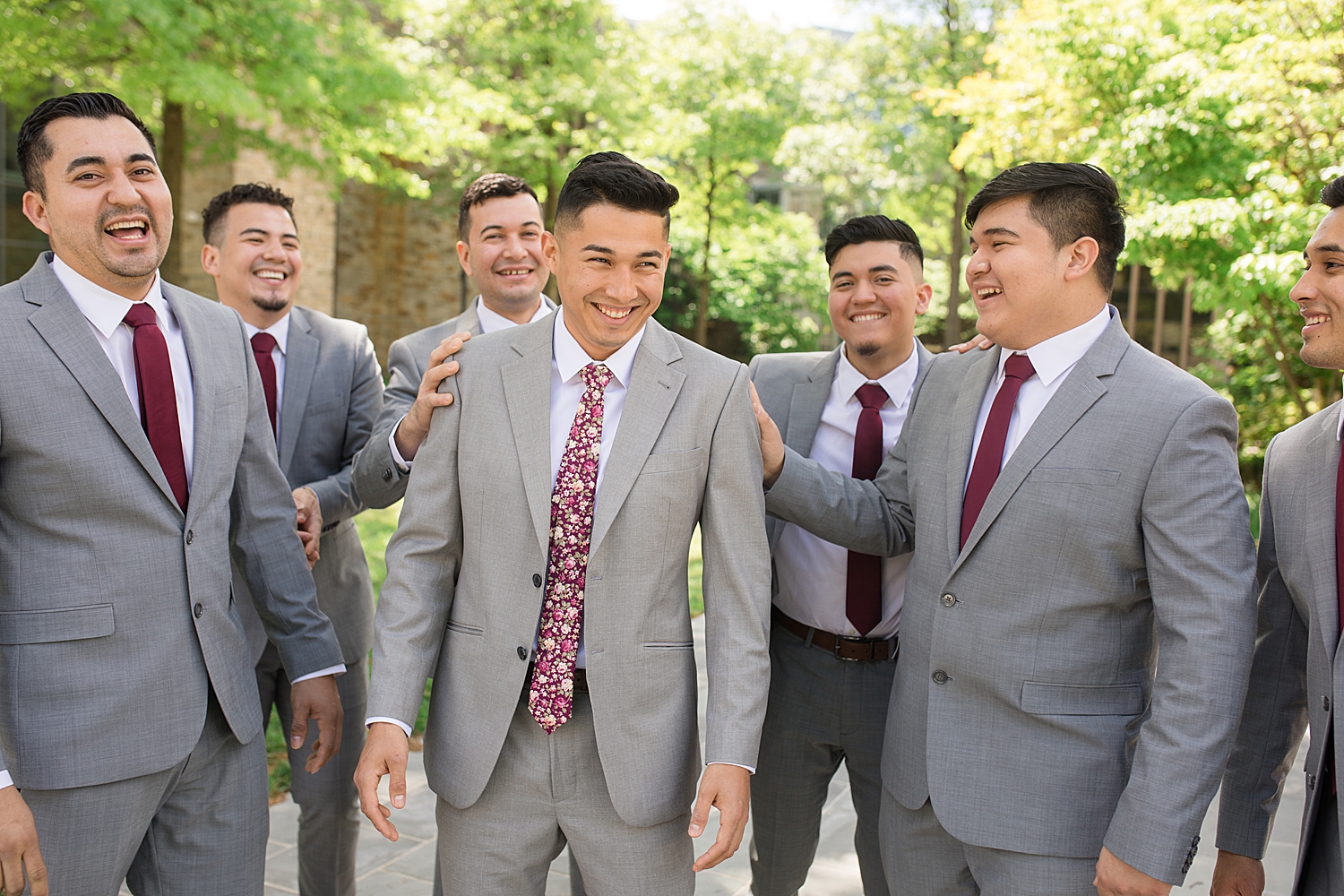 groom and groomsmen portrait in front of chapel