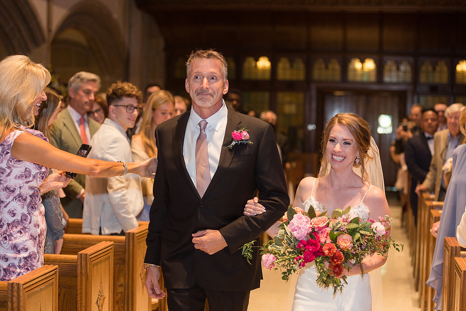 bride arrives at the end of the aisle with dad