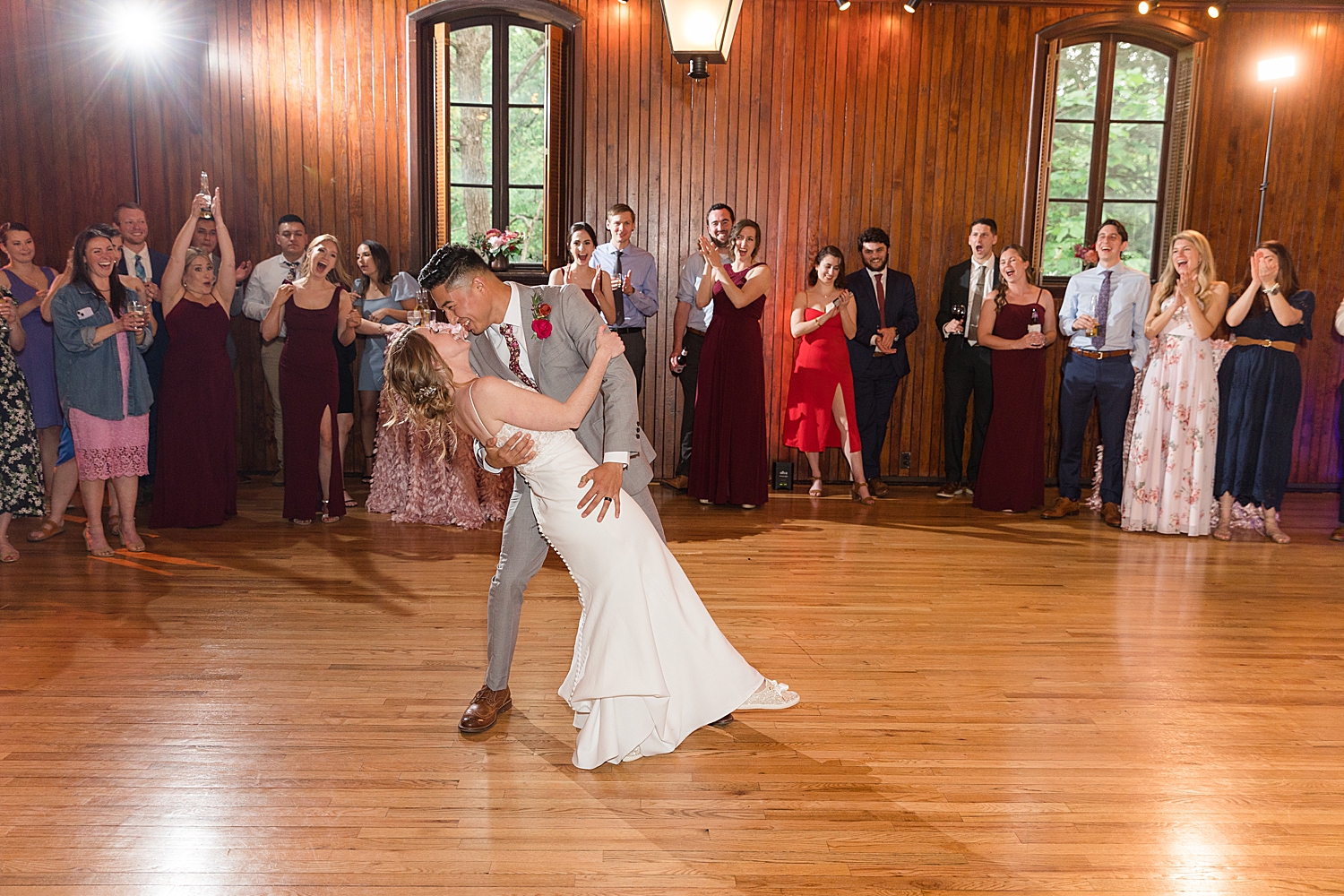 bride and groom first dance dip kiss