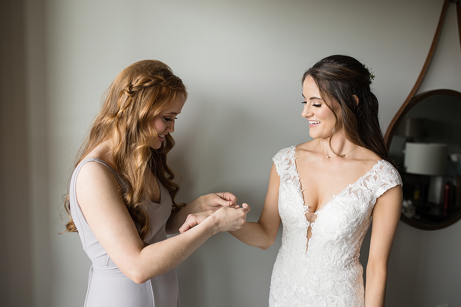 bride putting bracelet on