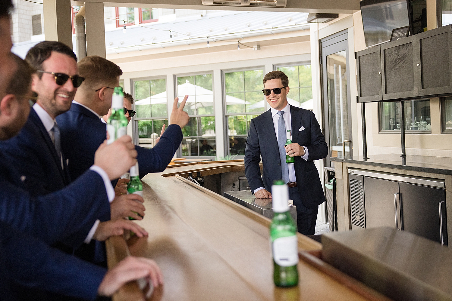 groom and groomsmen hang out at bar