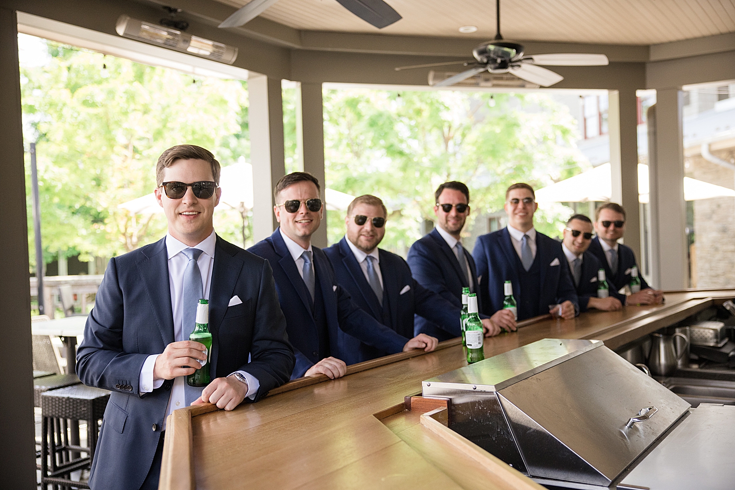 groom and groomsmen hang out at bar