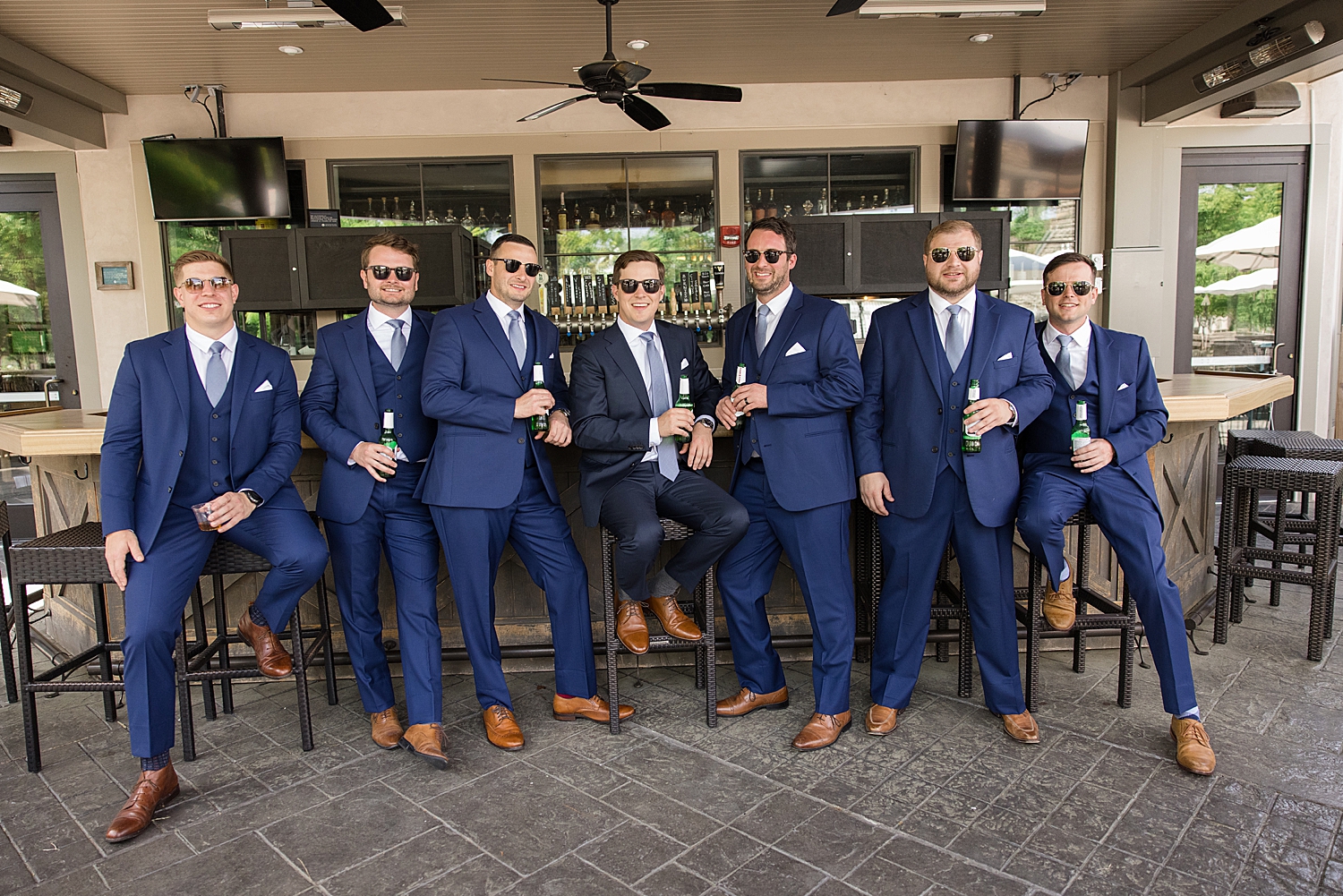 groom and groomsmen hang out at bar