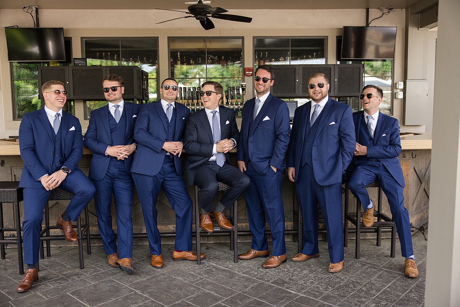 groom and groomsmen hang out at bar