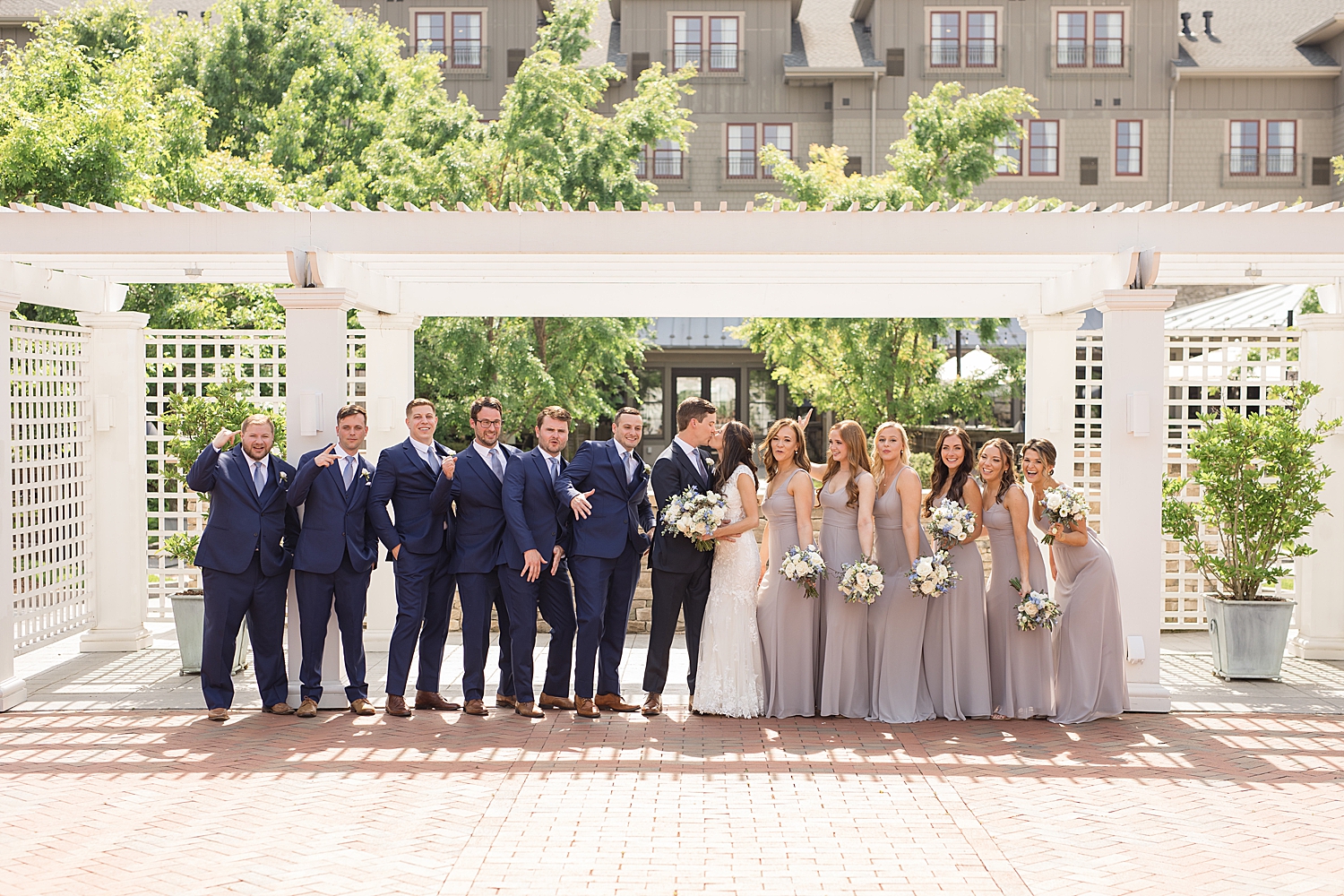 full wedding party celebrates at chesapeake bay beach club inn courtyard