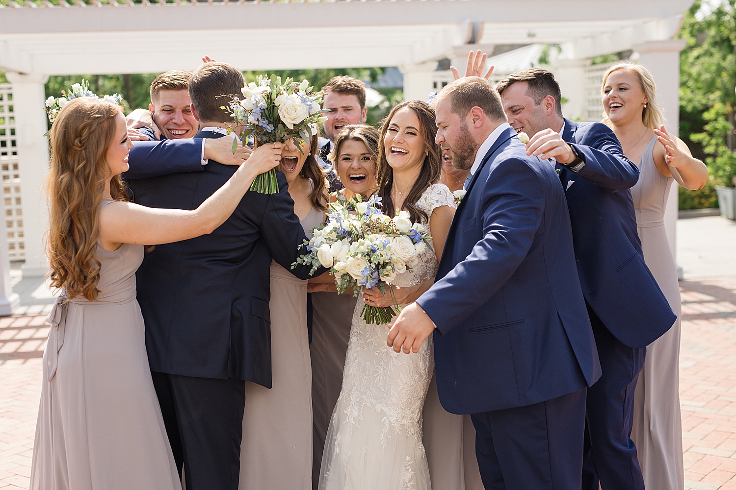 wedding party celebrates with newlyweds