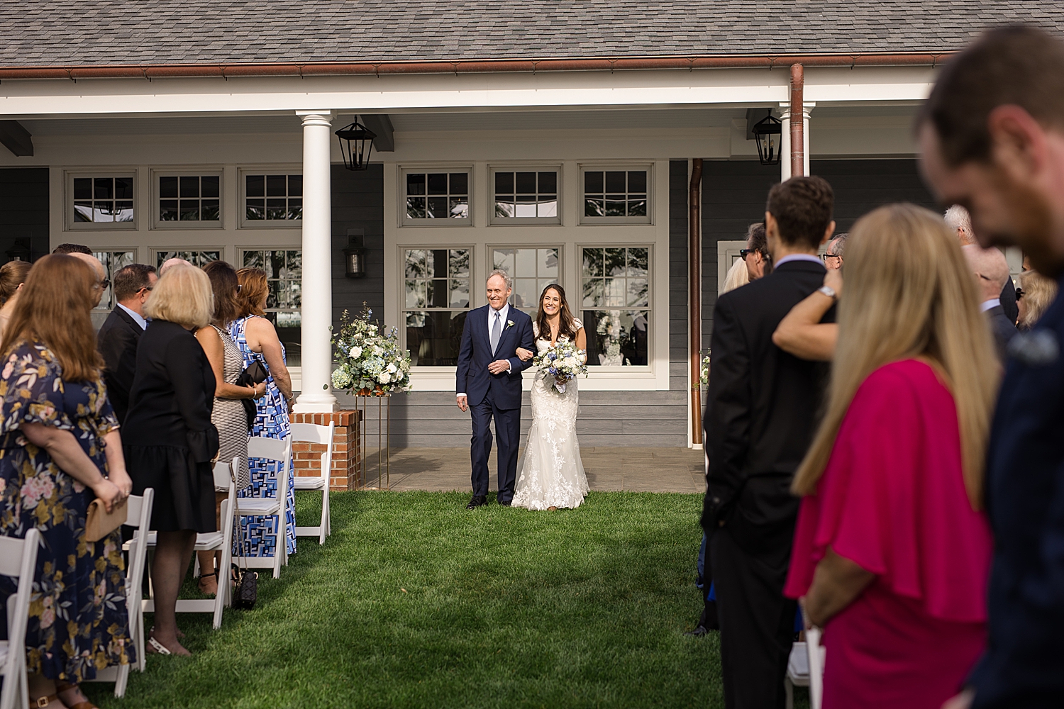 bride and her dad walking down the aisle