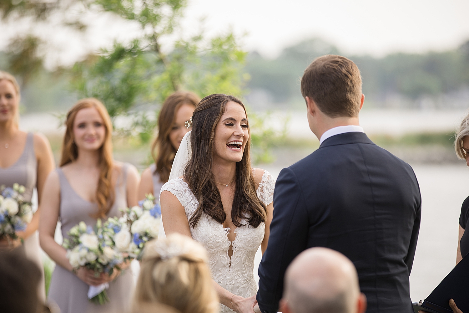 bride laughs during ceremony