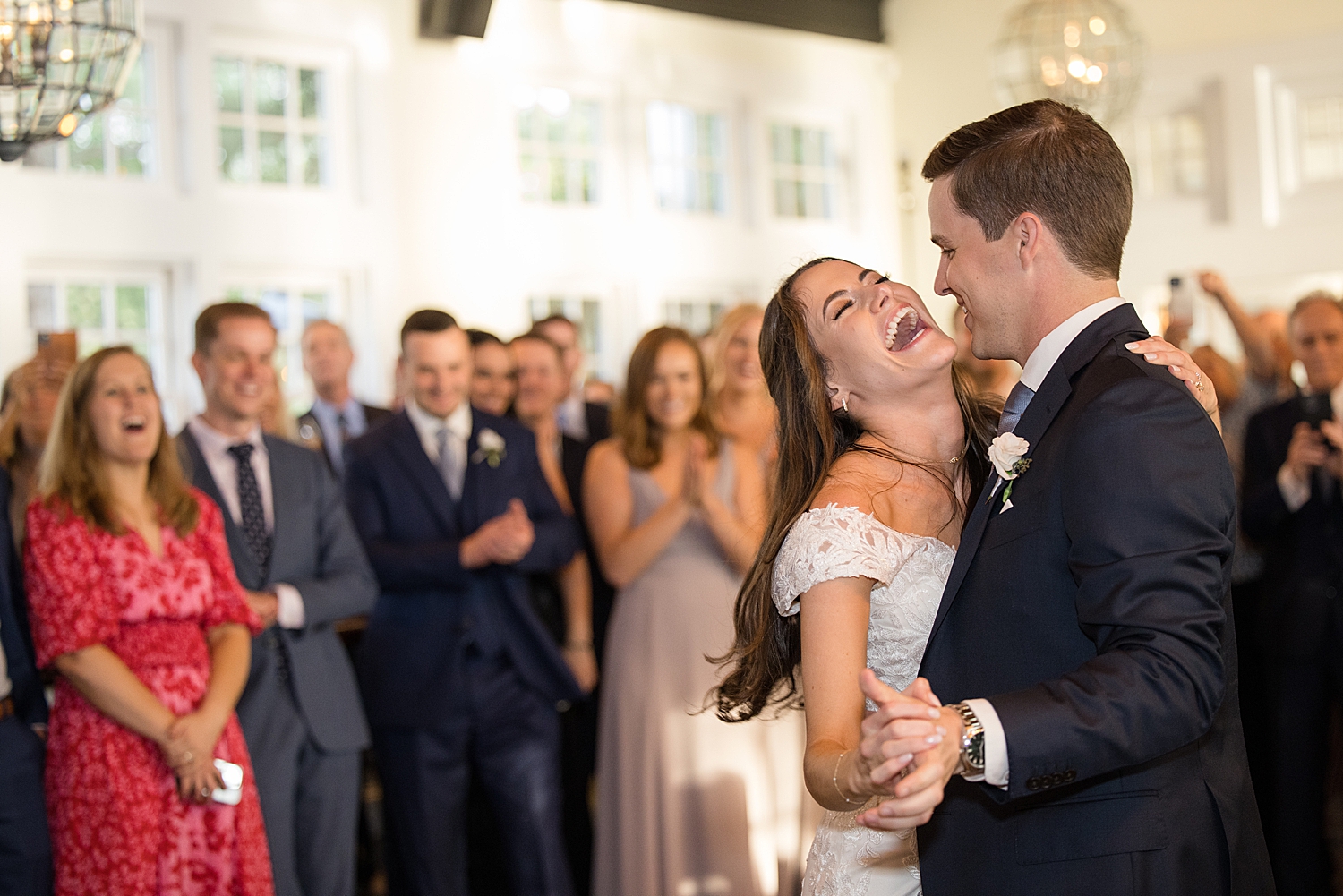 bride laughs during first dance