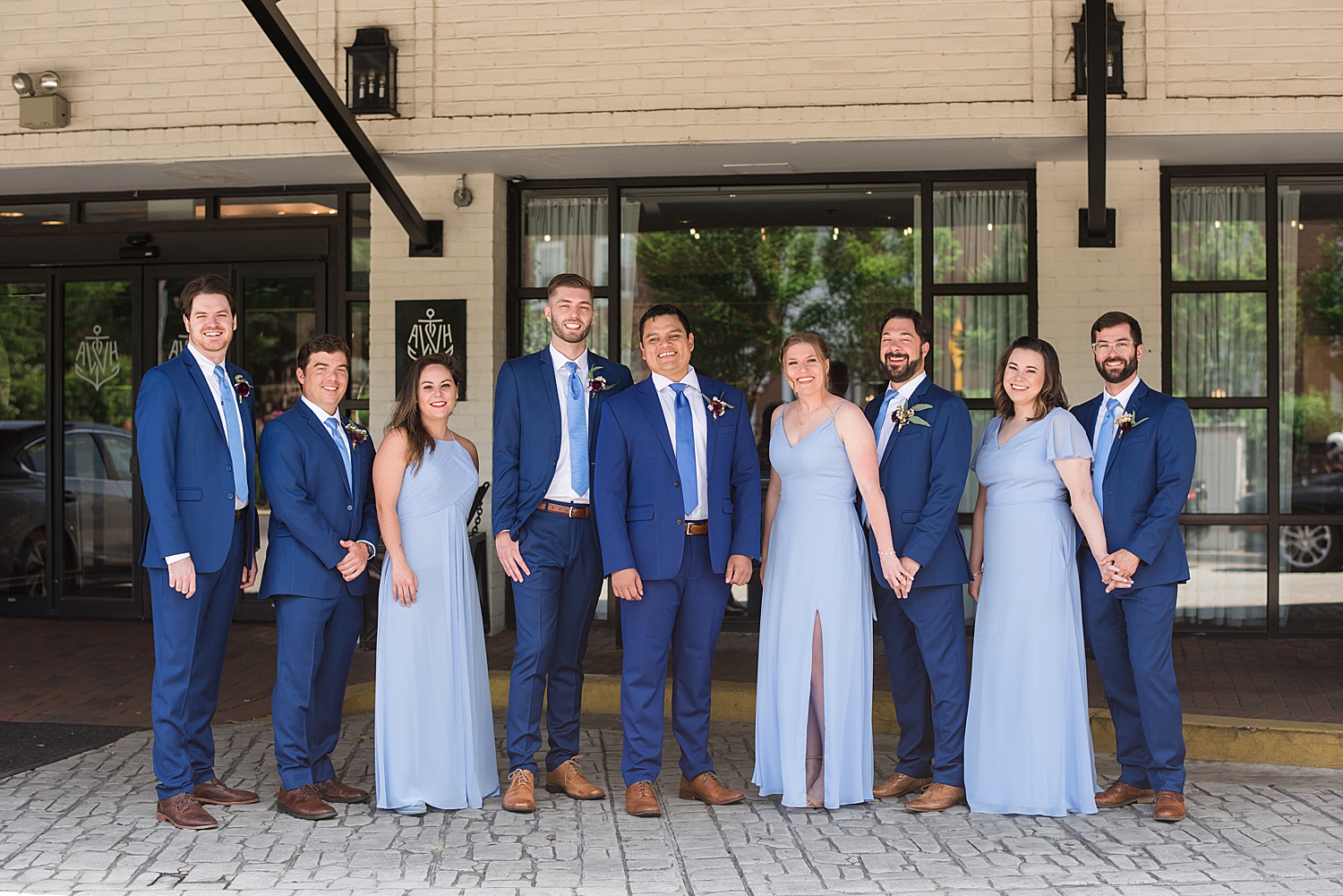 groom's party in blue dresses and blue suits