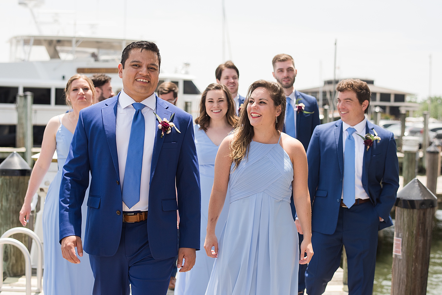 groom's party in blue dresses and blue suits