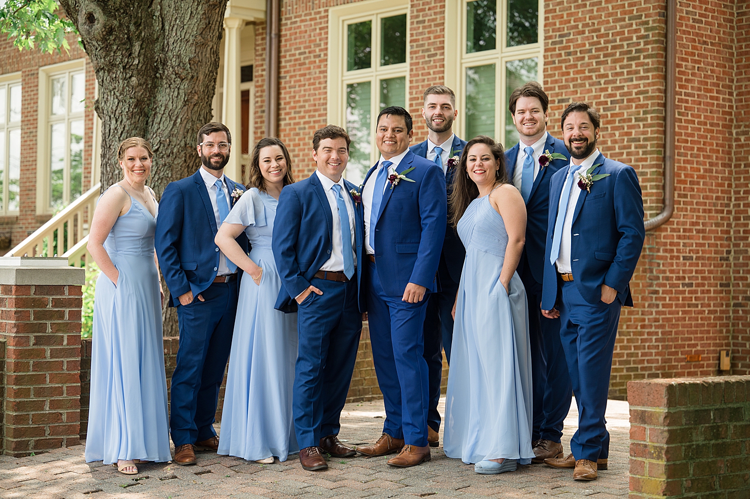 groom's party in blue dresses and blue suits