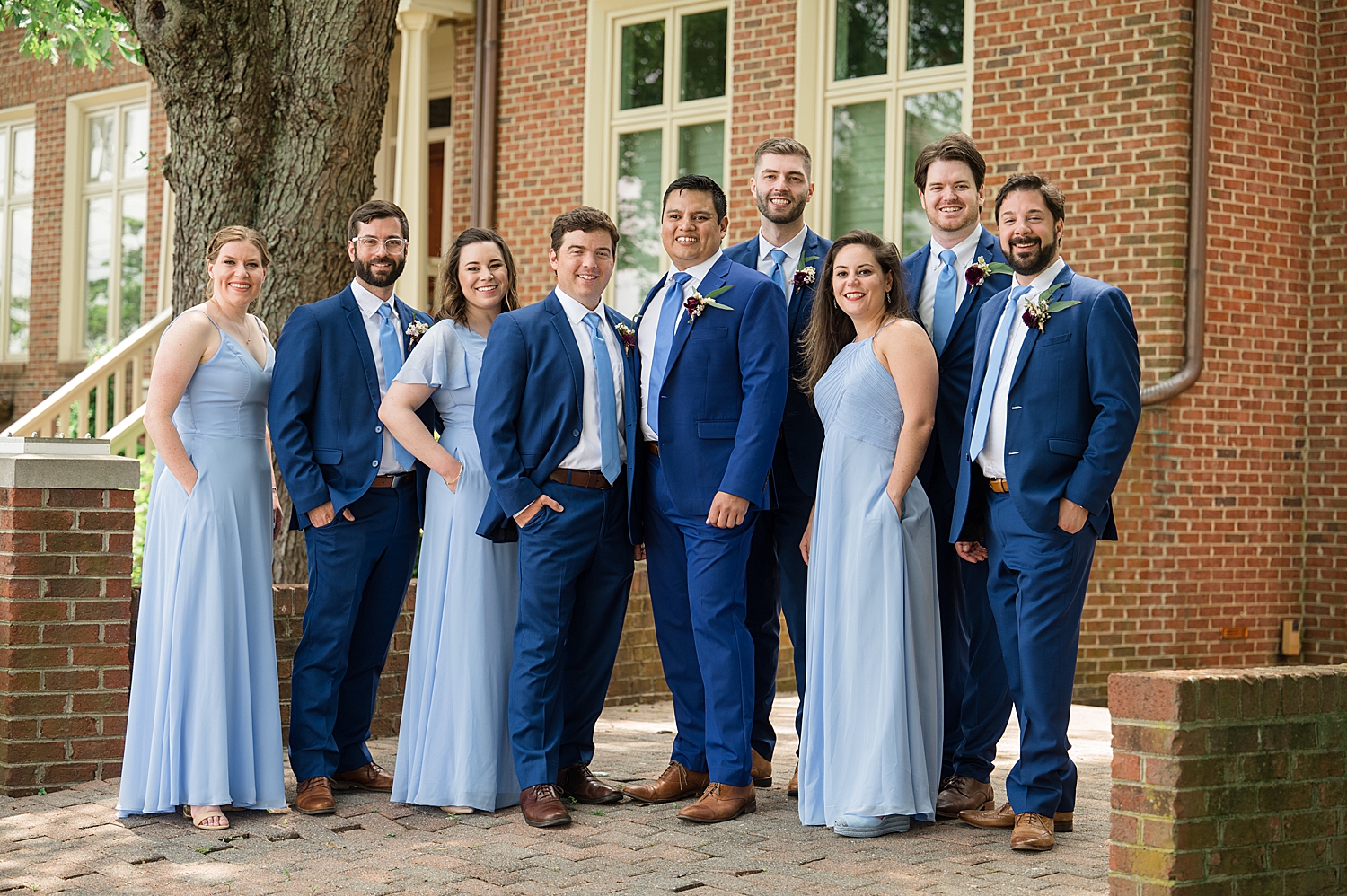 groom's party in blue dresses and blue suits