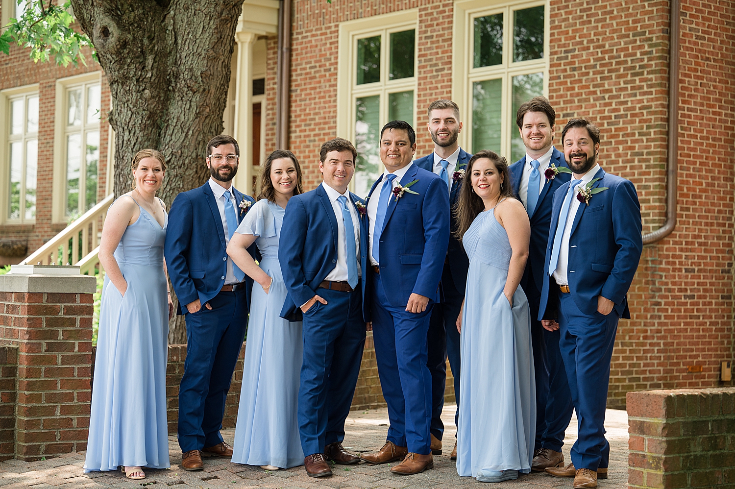 groom's party in blue dresses and blue suits