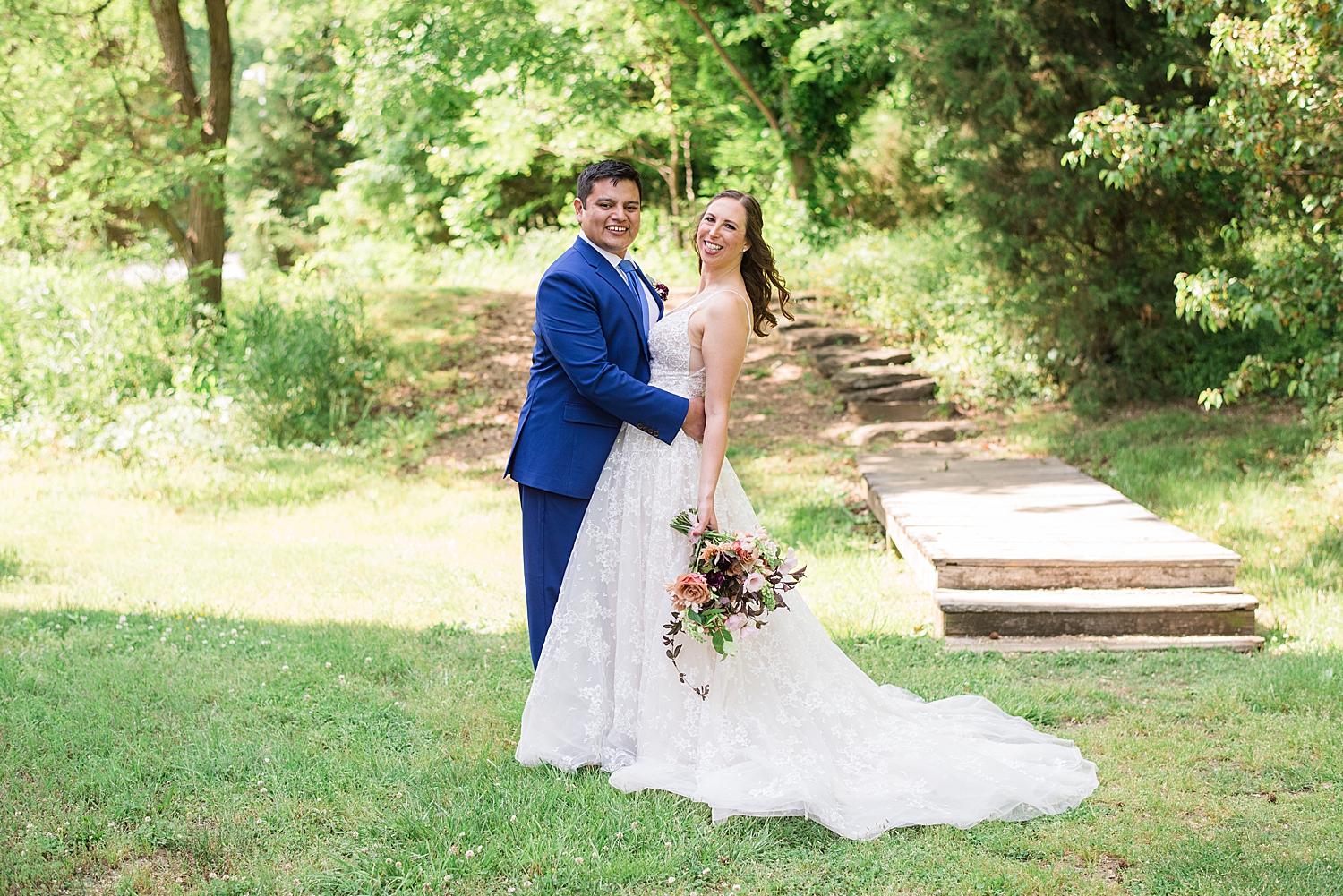 bride and groom portrait in grass