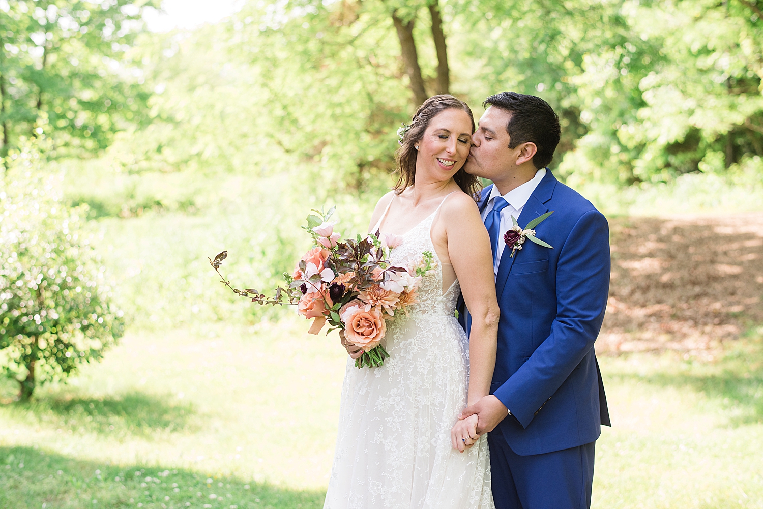 bride and groom portrait in grass