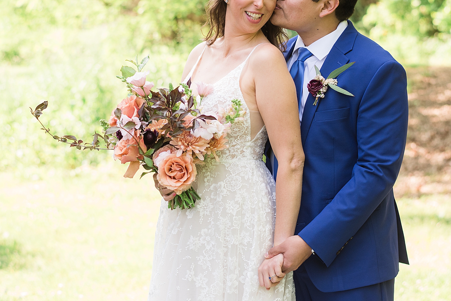 bride and groom portrait in grass