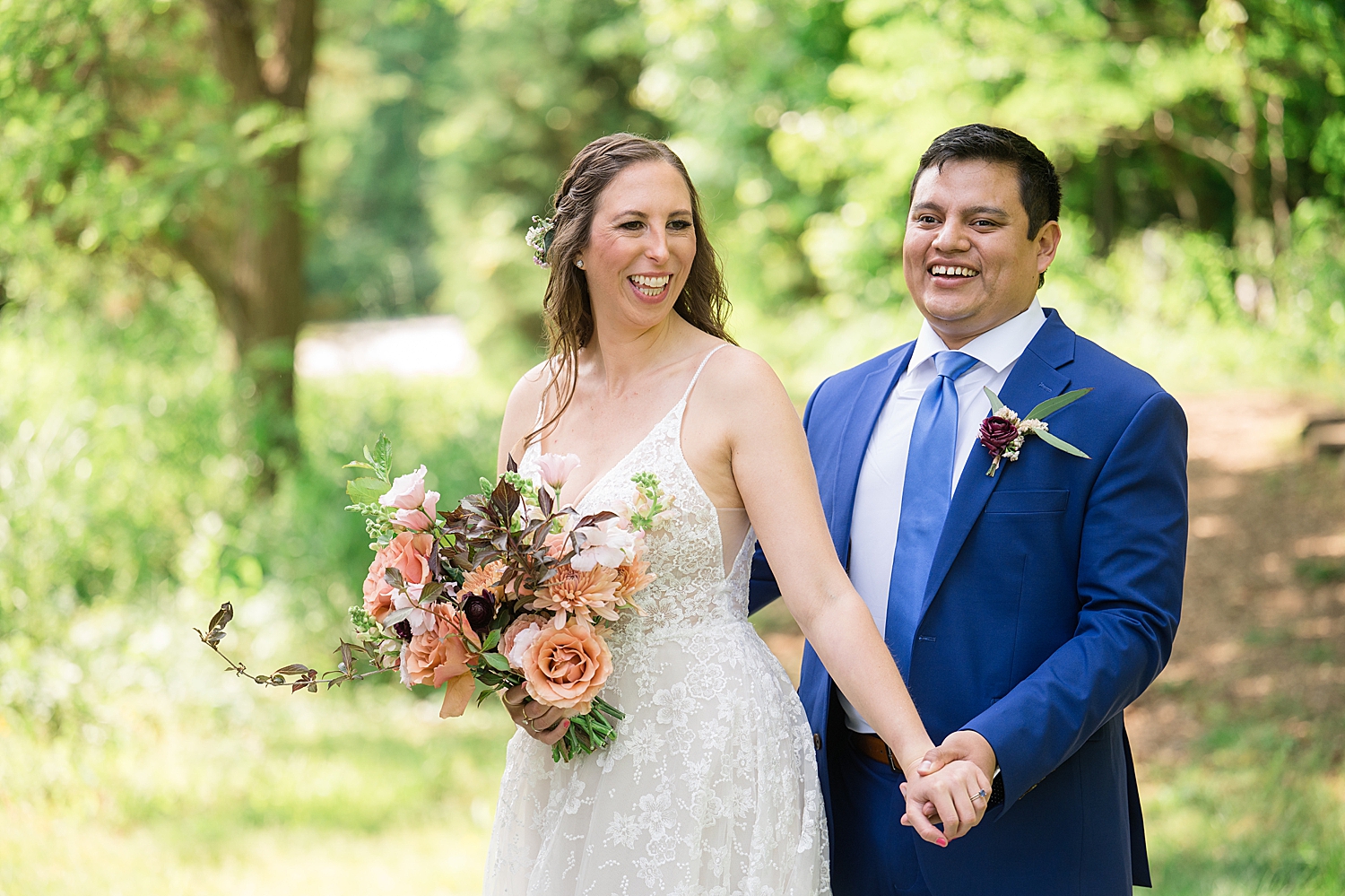 bride and groom portrait in grass