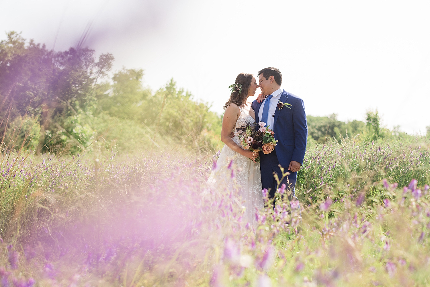 bride and groom portrait through flowers