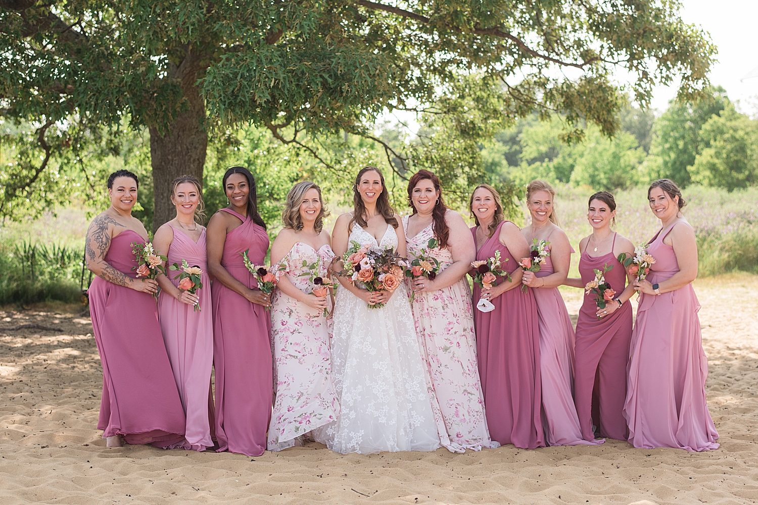 bride's party in a mix of pink shades dresses